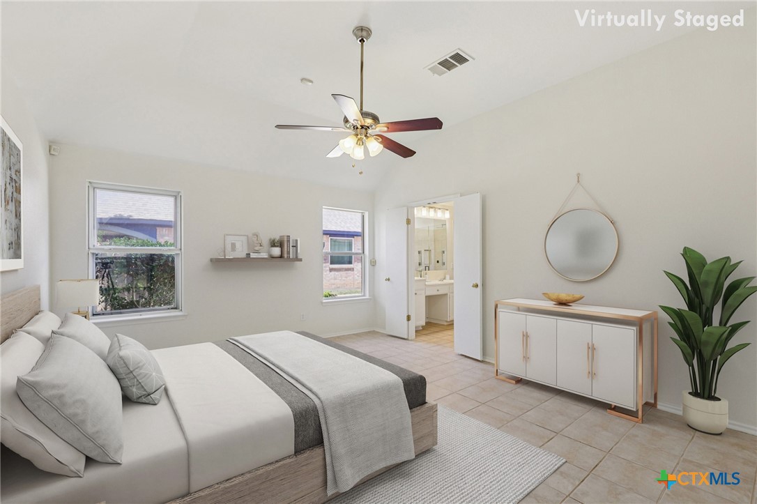 303 North Kings Canyon Drive Cedar Park, TX 78613 - Photo 8 of 24 a bedroom with a bed chandelier and a window