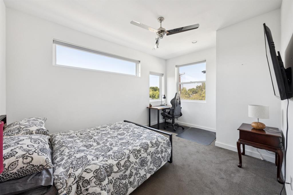 4903 Jack Court Dallas, TX 75206 - Photo 13 of 26 a bedroom with bed and a window
