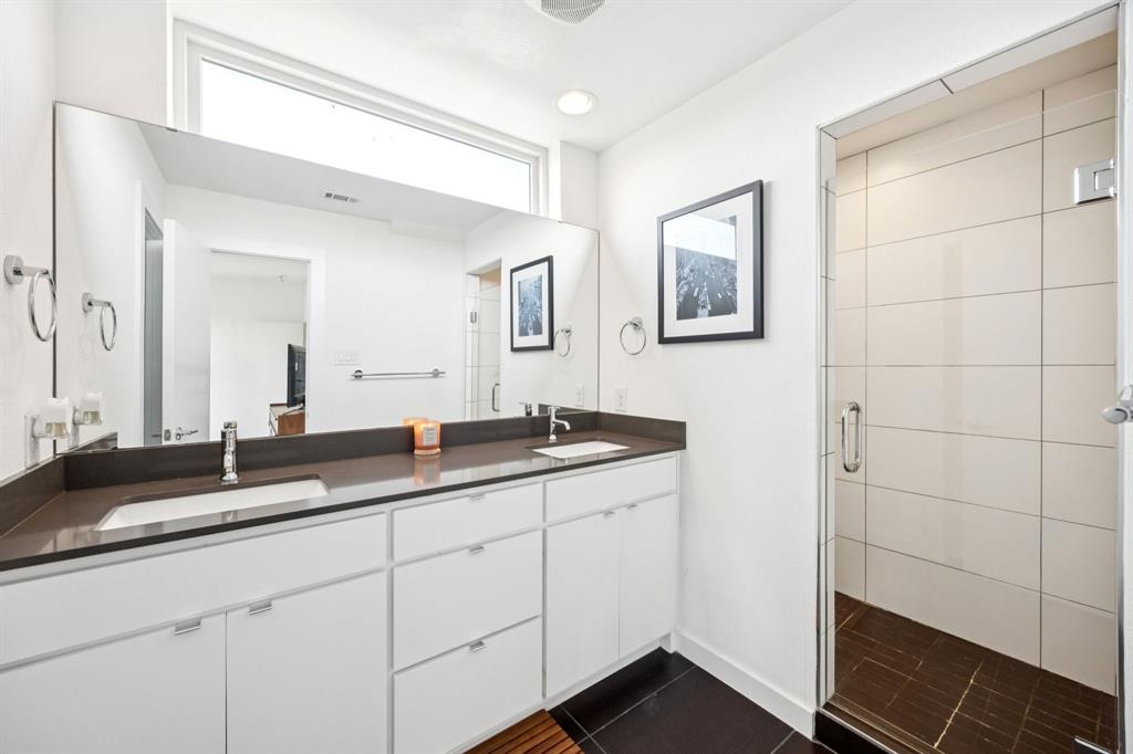 4903 Jack Court Dallas, TX 75206 - Photo 16 of 26 a bathroom with a double vanity sink and mirror