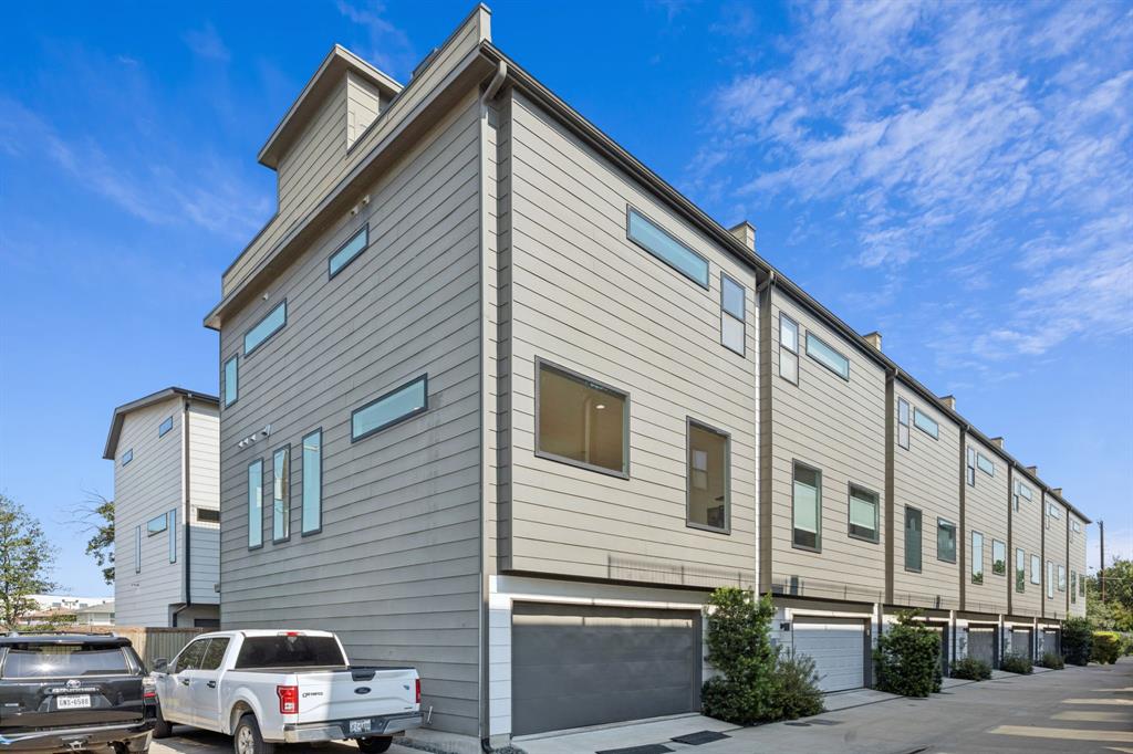 4903 Jack Court Dallas, TX 75206 - Photo 20 of 26 a car parked in front of a white house
