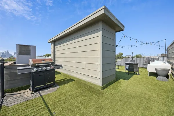 a view of a patio in the backyard