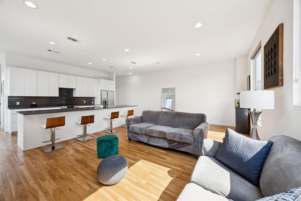 4903 Jack Court Dallas, TX 75206 - Photo 6 of 26 a living room with furniture and kitchen view