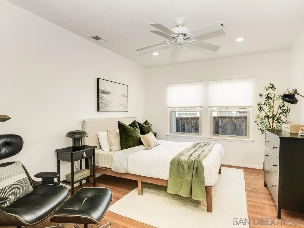 4611 Natalie Drive San Diego, CA 92115 - Photo 21 of 41 a bedroom with a bed window and a chair