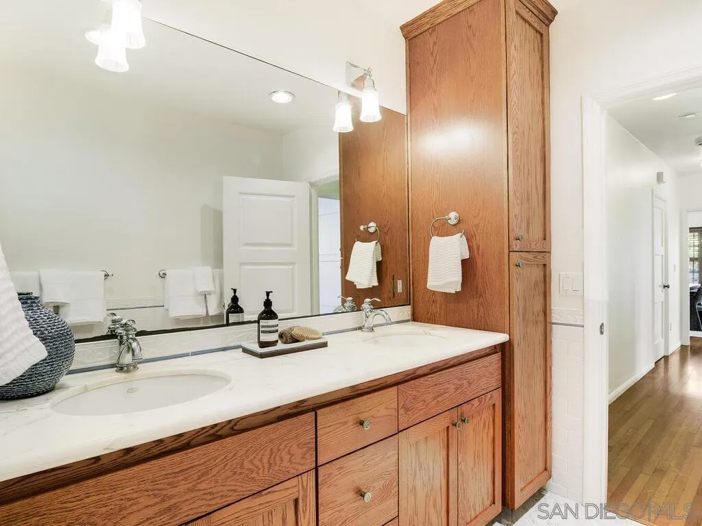 4611 Natalie Drive San Diego, CA 92115 - Photo 27 of 41 a bathroom with a sink and a mirror