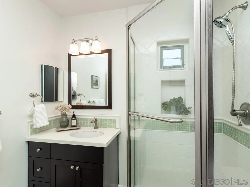 4611 Natalie Drive San Diego, CA 92115 - Photo 32 of 41 a bathroom with a sink vanity and a mirror