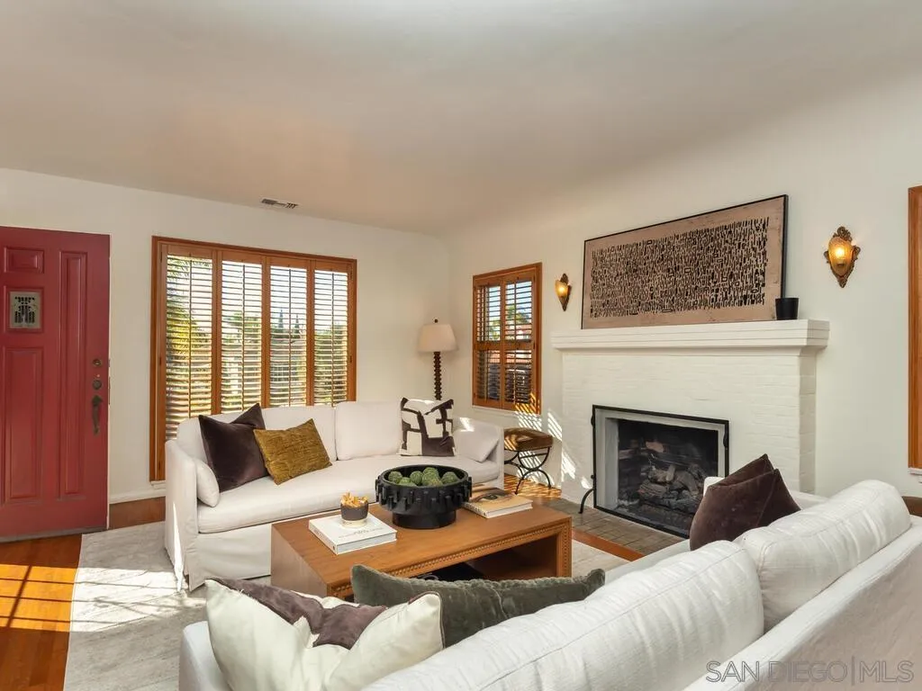 4611 Natalie Drive San Diego, CA 92115 - Photo 5 of 41 a living room with furniture a fireplace and a floor to ceiling window