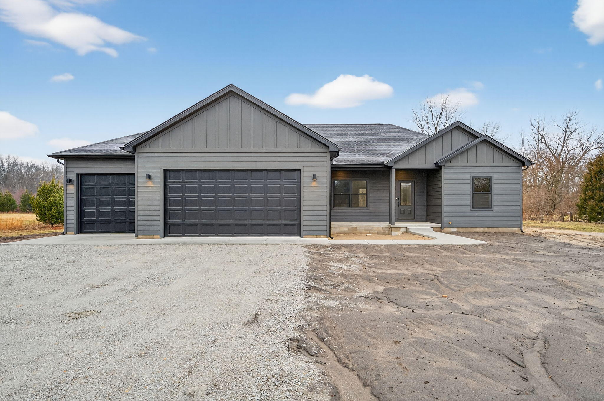 238 East 550 North Rensselaer, IN 47978 - Photo 2 of 33 a front view of a house with a yard and garage