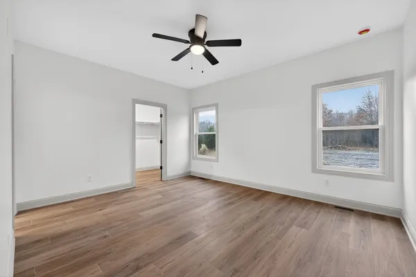 a bathroom with 2 sink and a mirror