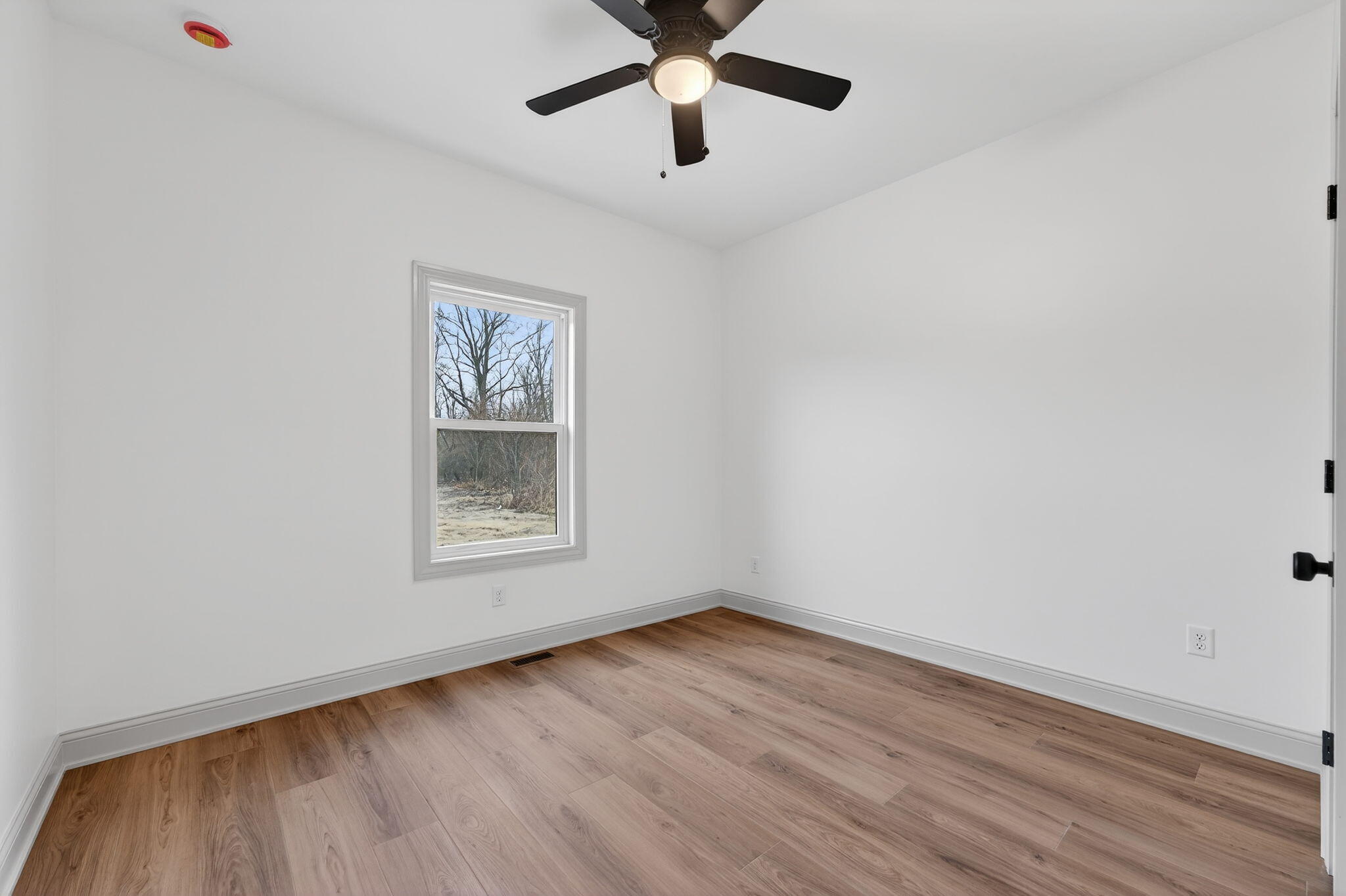 238 East 550 North Rensselaer, IN 47978 - Photo 27 of 35 wooden floor in an empty room with a window