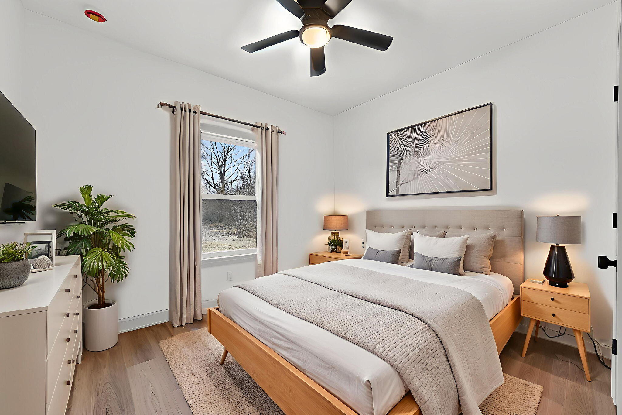 238 East 550 North Rensselaer, IN 47978 - Photo 28 of 35 a bedroom with a bed and a potted plant