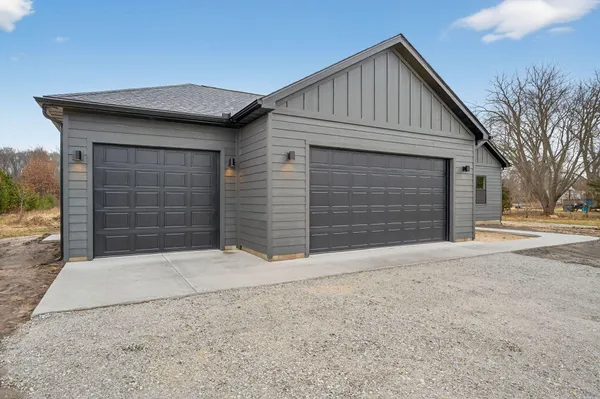 a front view of a house with a garage