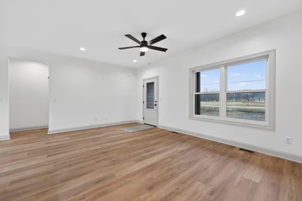 a living room with furniture and a large window