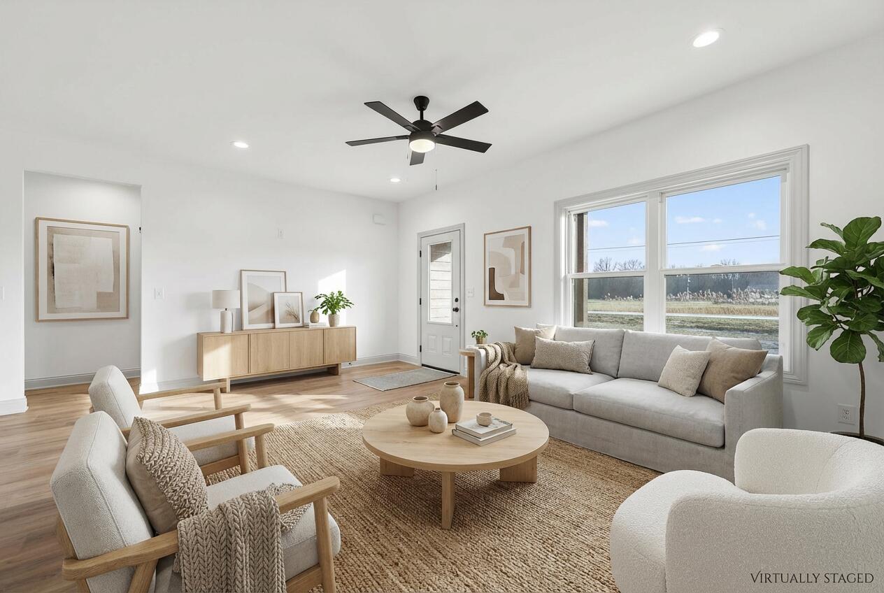 238 East 550 North Rensselaer, IN 47978 - Photo 9 of 35 a living room with furniture and a large window