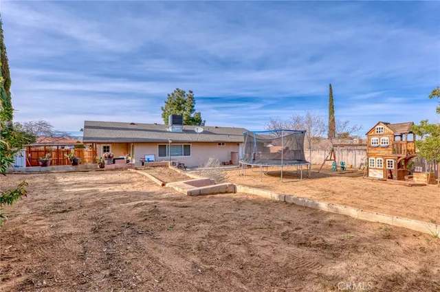 a view of a backyard of the house