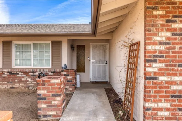 image of a brick house with large windows