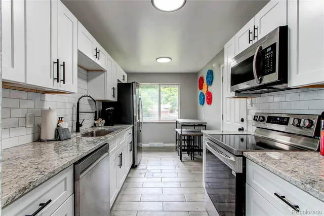 a kitchen with lots of counter top space and cabinets