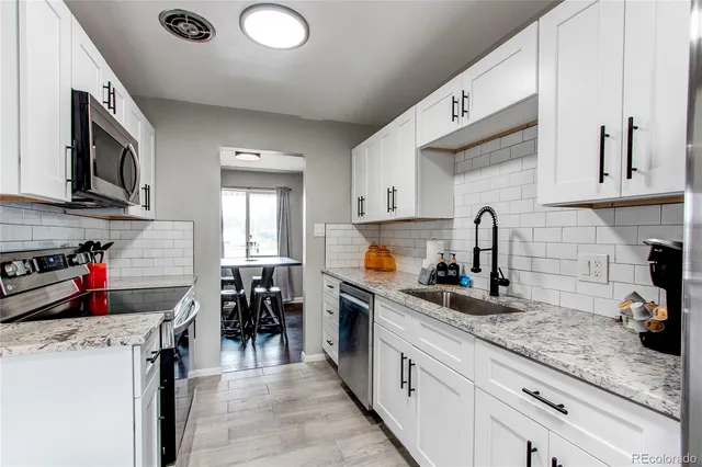 a view of kitchen and dining area with furniture