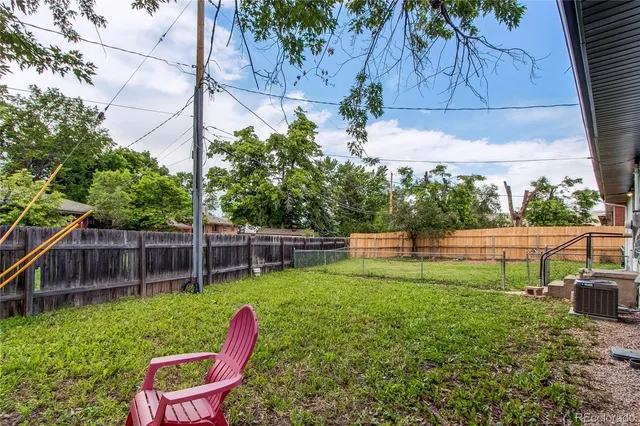 a view of a chair and table in the garden