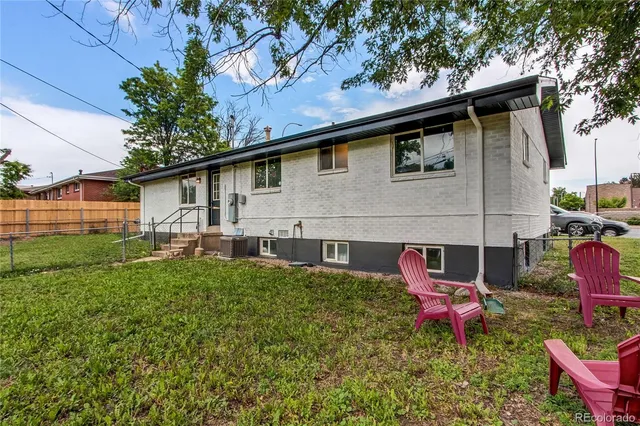 a view of a backyard with a garden and trees
