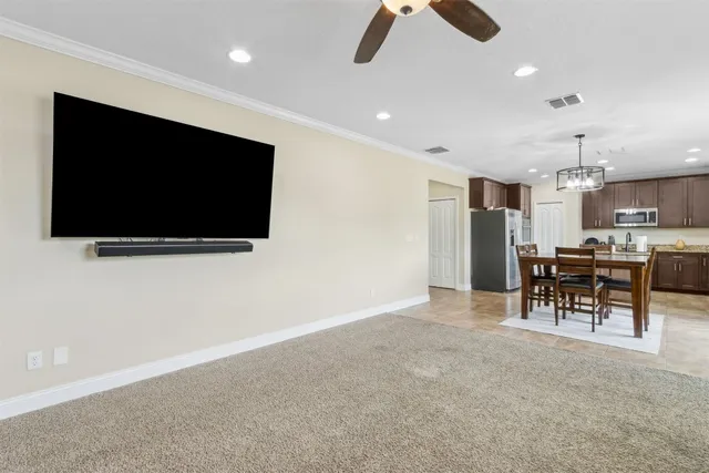 a view of a dining room with furniture window and outside view