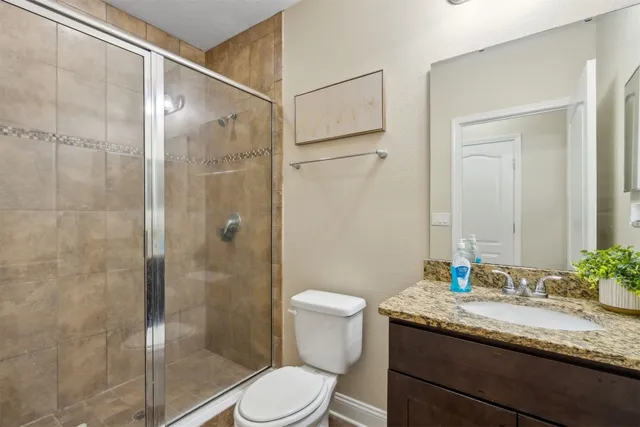 a view of staircase with white walls and a window