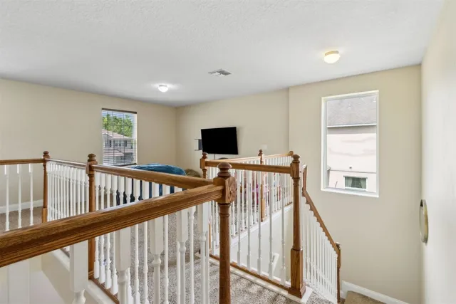 a bedroom with a bed closet and dresser