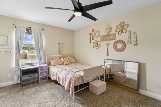 a bedroom with furniture and a window