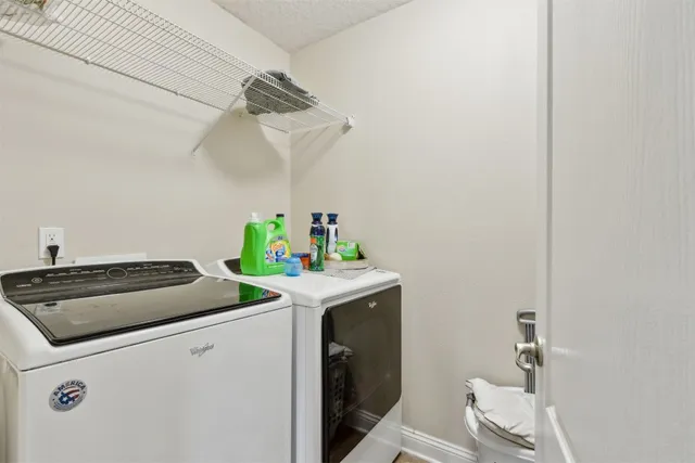 a view of a backyard with sitting area