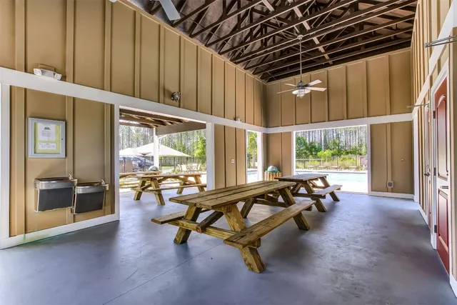 a view of swimming pool with sitting area and slide