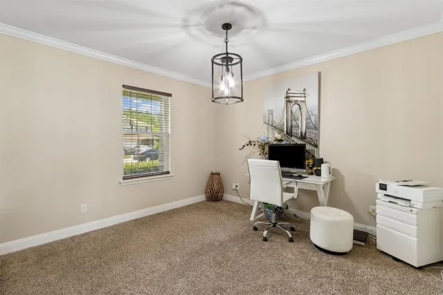 a view of a hallway with wooden floor and a living room