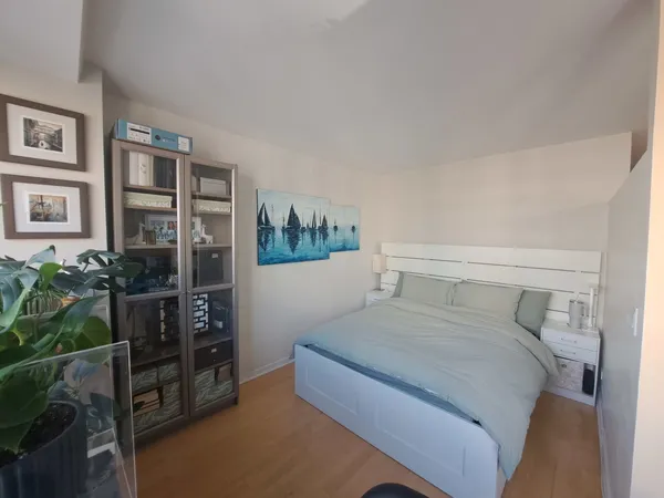 a bedroom with a bed furniture and decor