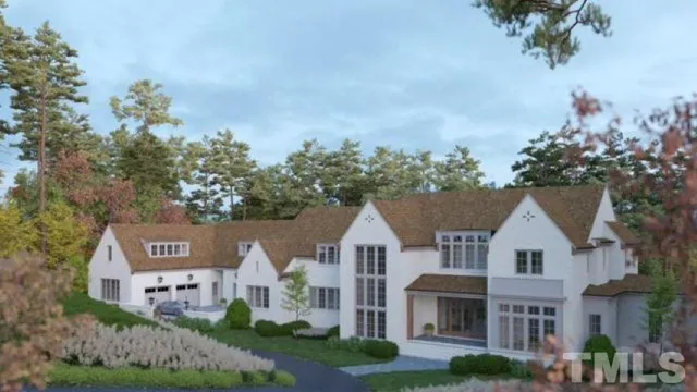 a view of house with yard and trees in the background