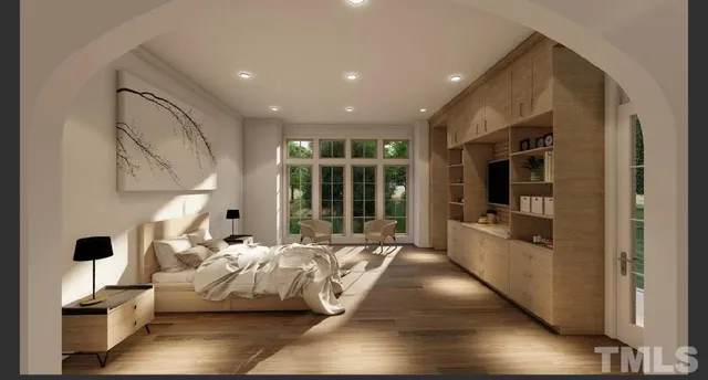 a large bedroom with bed and a large window