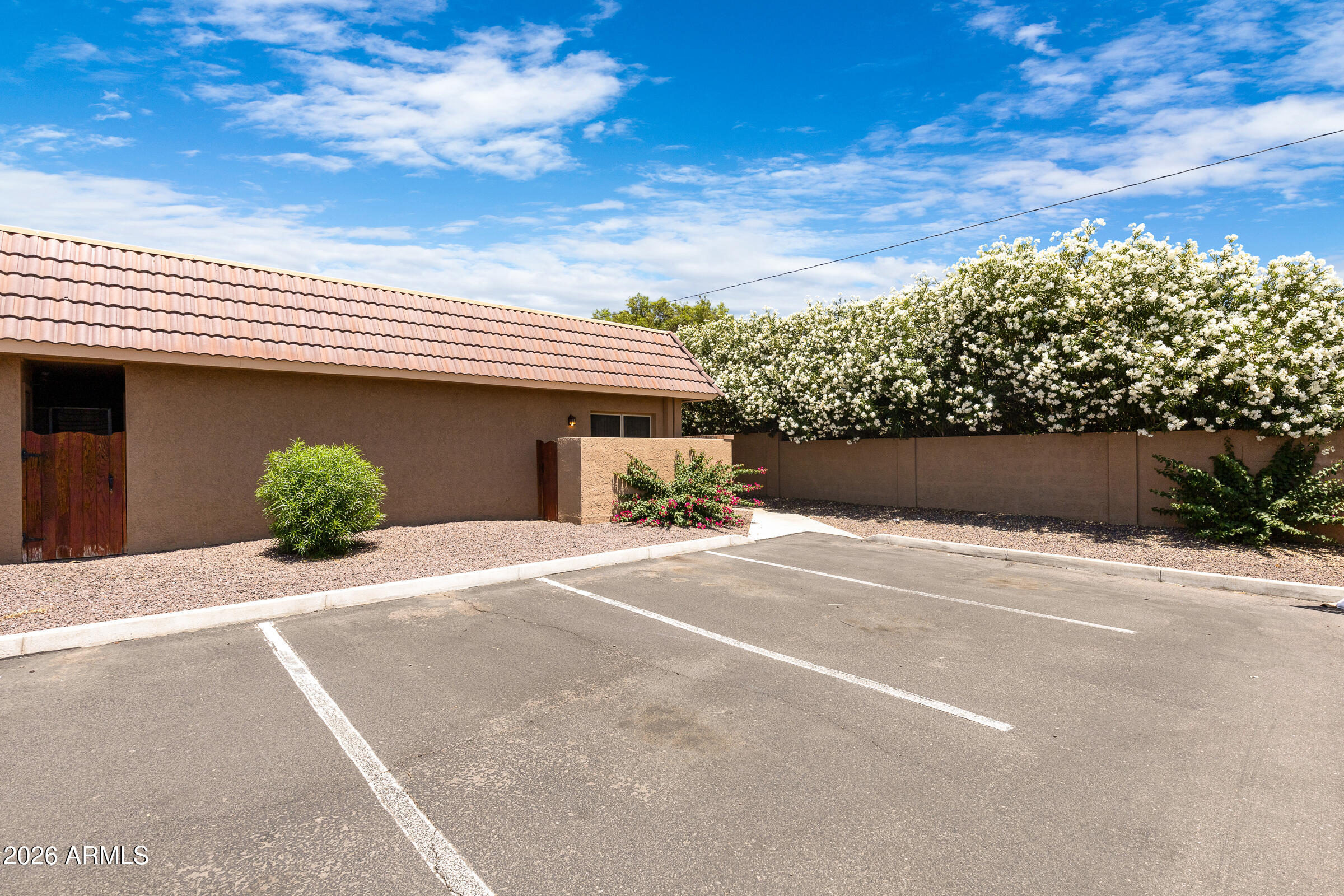 20235 North 3rd Drive, Unit 8 Phoenix, AZ 85027 - Photo 1 of 30 a front view of a house with a yard and garage