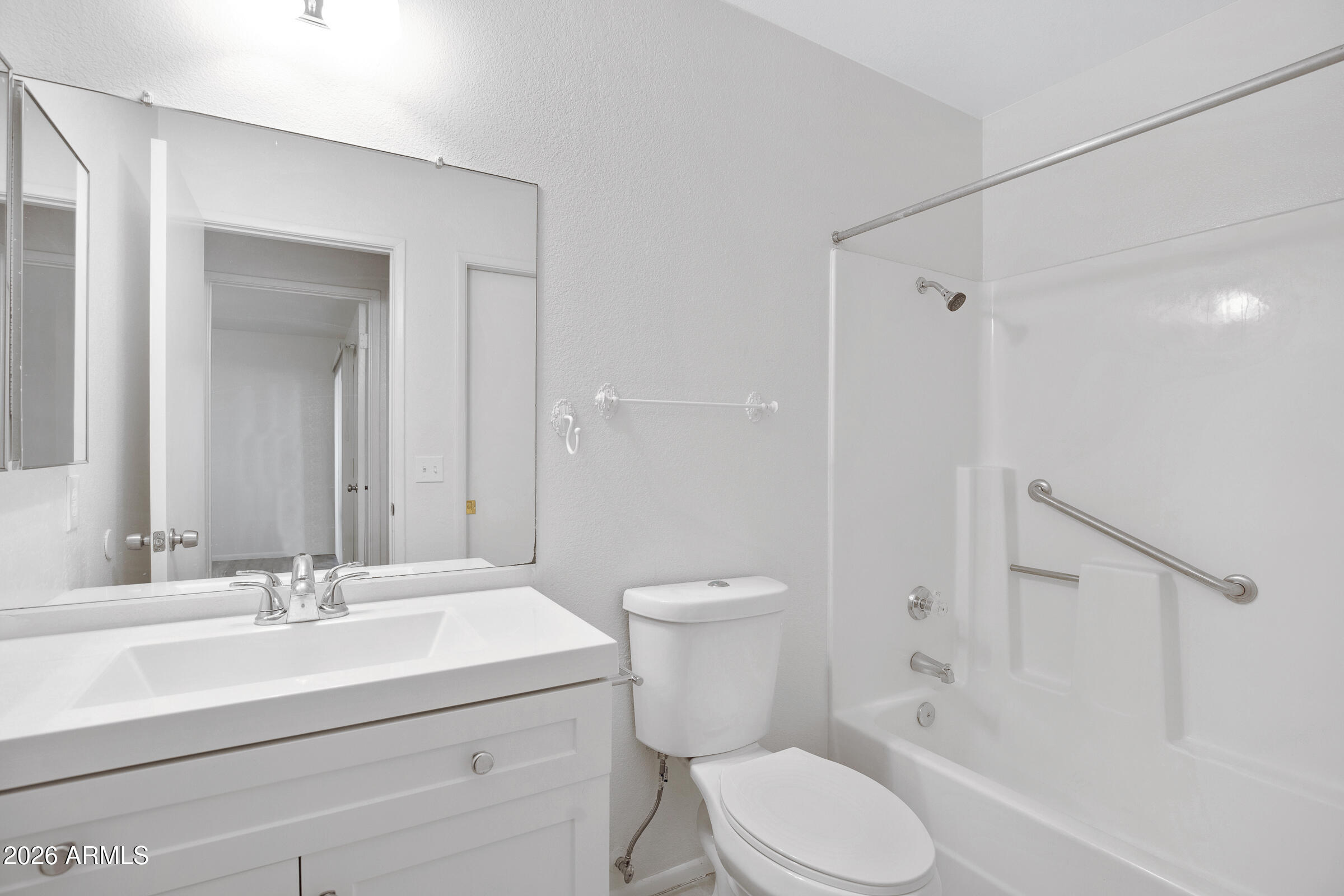 20235 North 3rd Drive, Unit 8 Phoenix, AZ 85027 - Photo 11 of 30 a bathroom with a sink toilet and shower