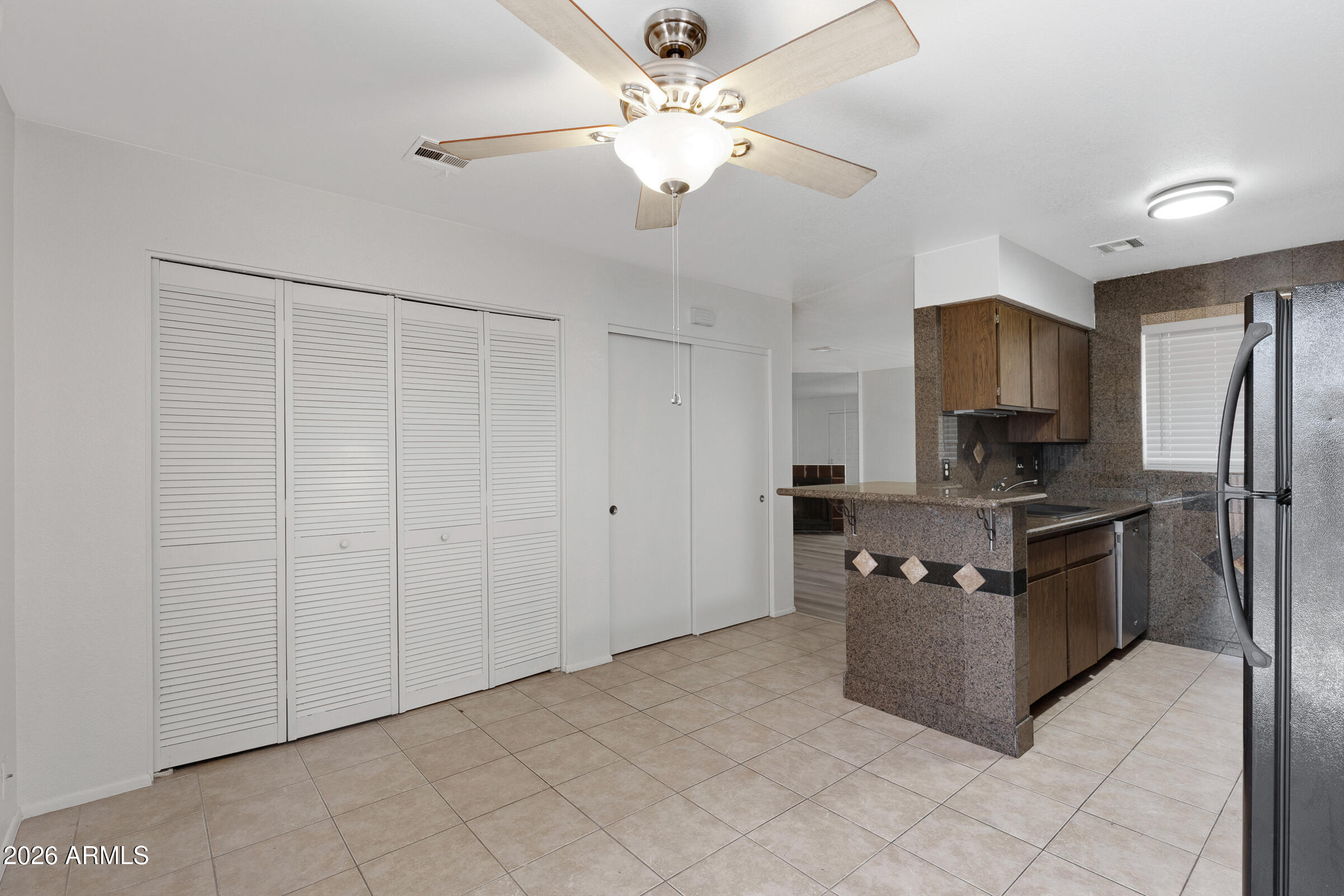 20235 North 3rd Drive, Unit 8 Phoenix, AZ 85027 - Photo 17 of 30 a kitchen with stainless steel appliances a refrigerator and a stove