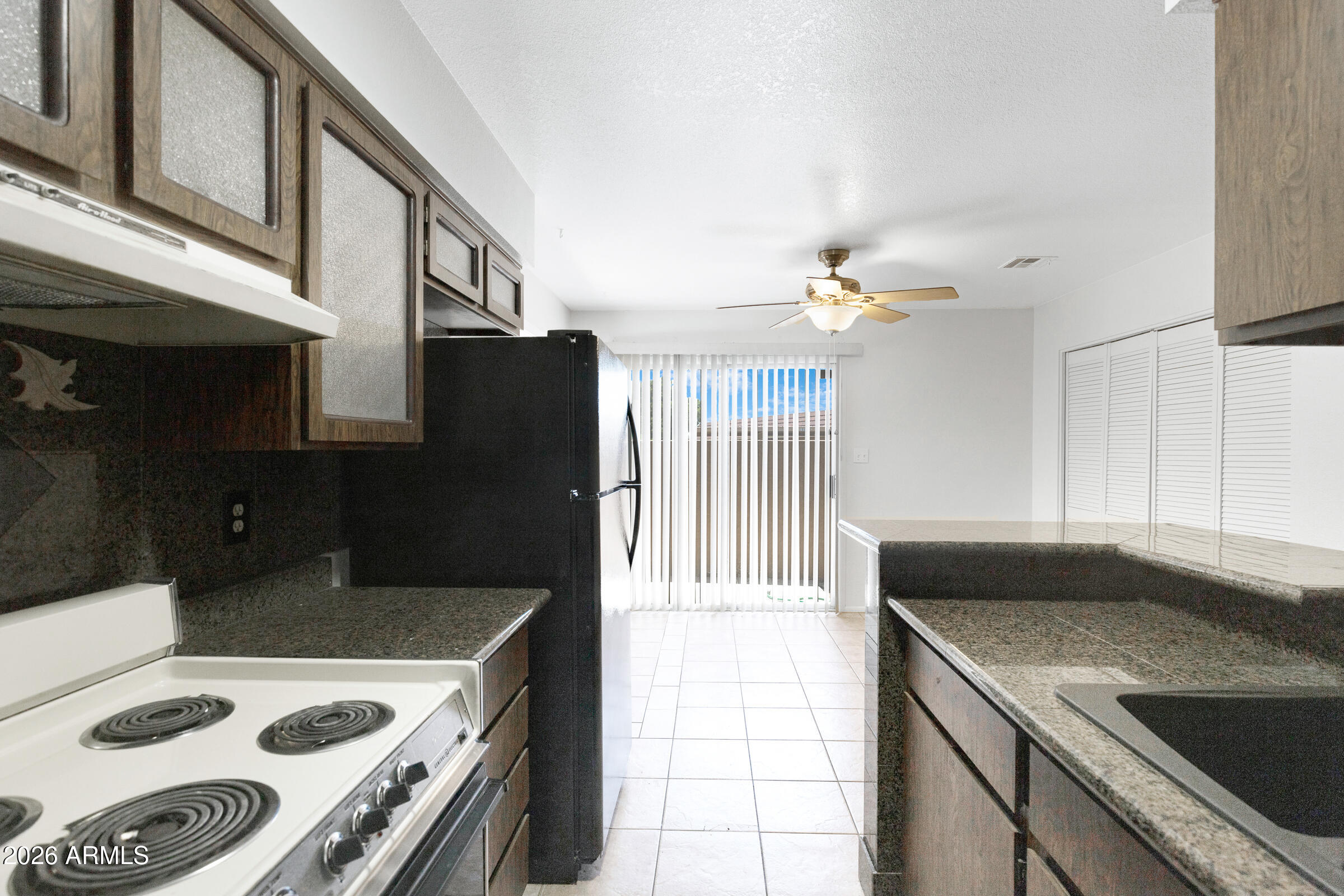 20235 North 3rd Drive, Unit 8 Phoenix, AZ 85027 - Photo 22 of 30 a kitchen with a stove and a refrigerator