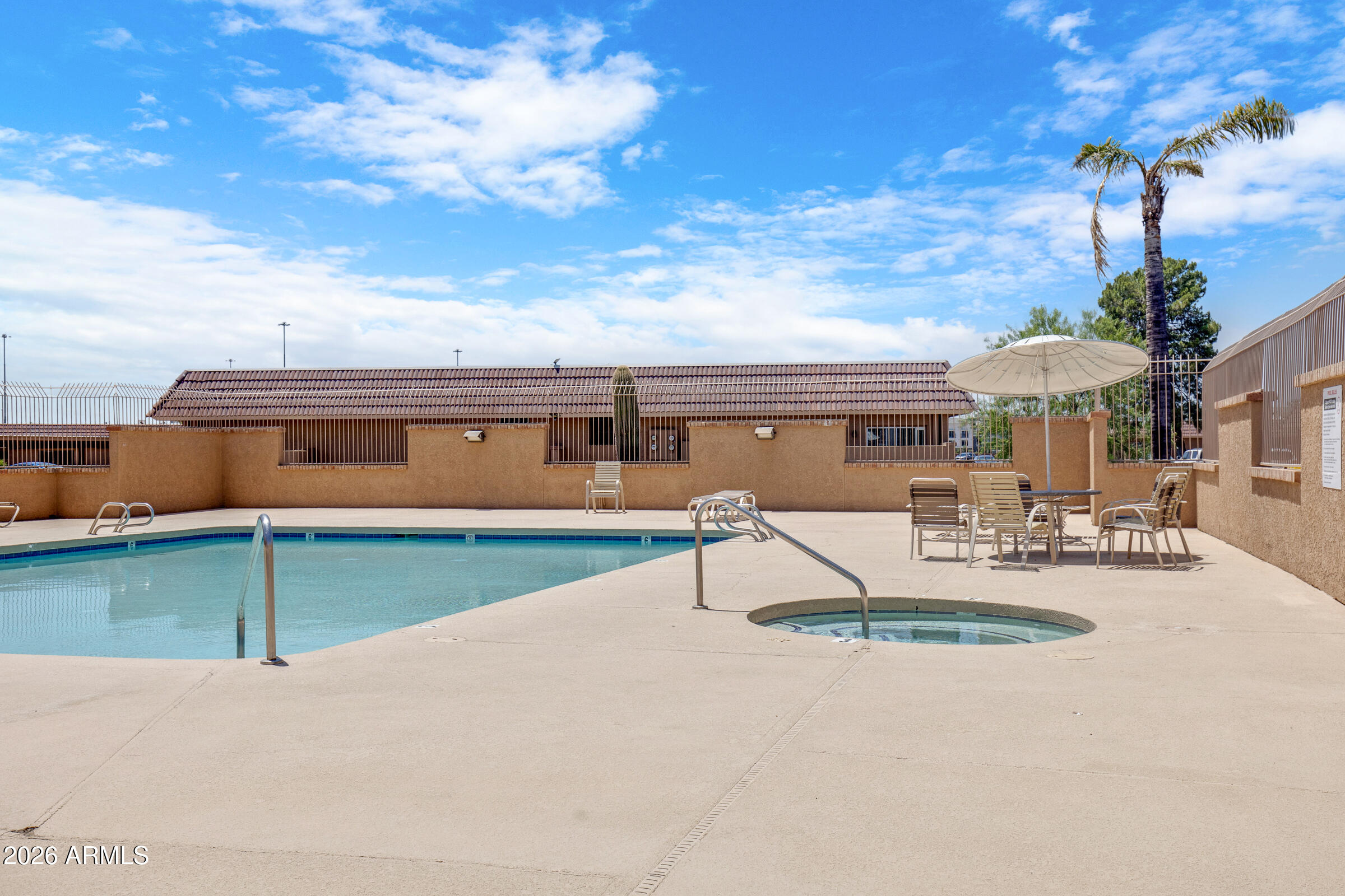 20235 North 3rd Drive, Unit 8 Phoenix, AZ 85027 - Photo 26 of 30 a view of a swimming pool with a patio