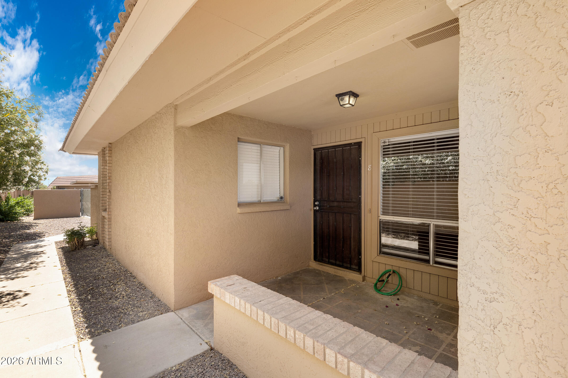 20235 North 3rd Drive, Unit 8 Phoenix, AZ 85027 - Photo 28 of 30 a bathroom with a granite countertop sink and a mirror