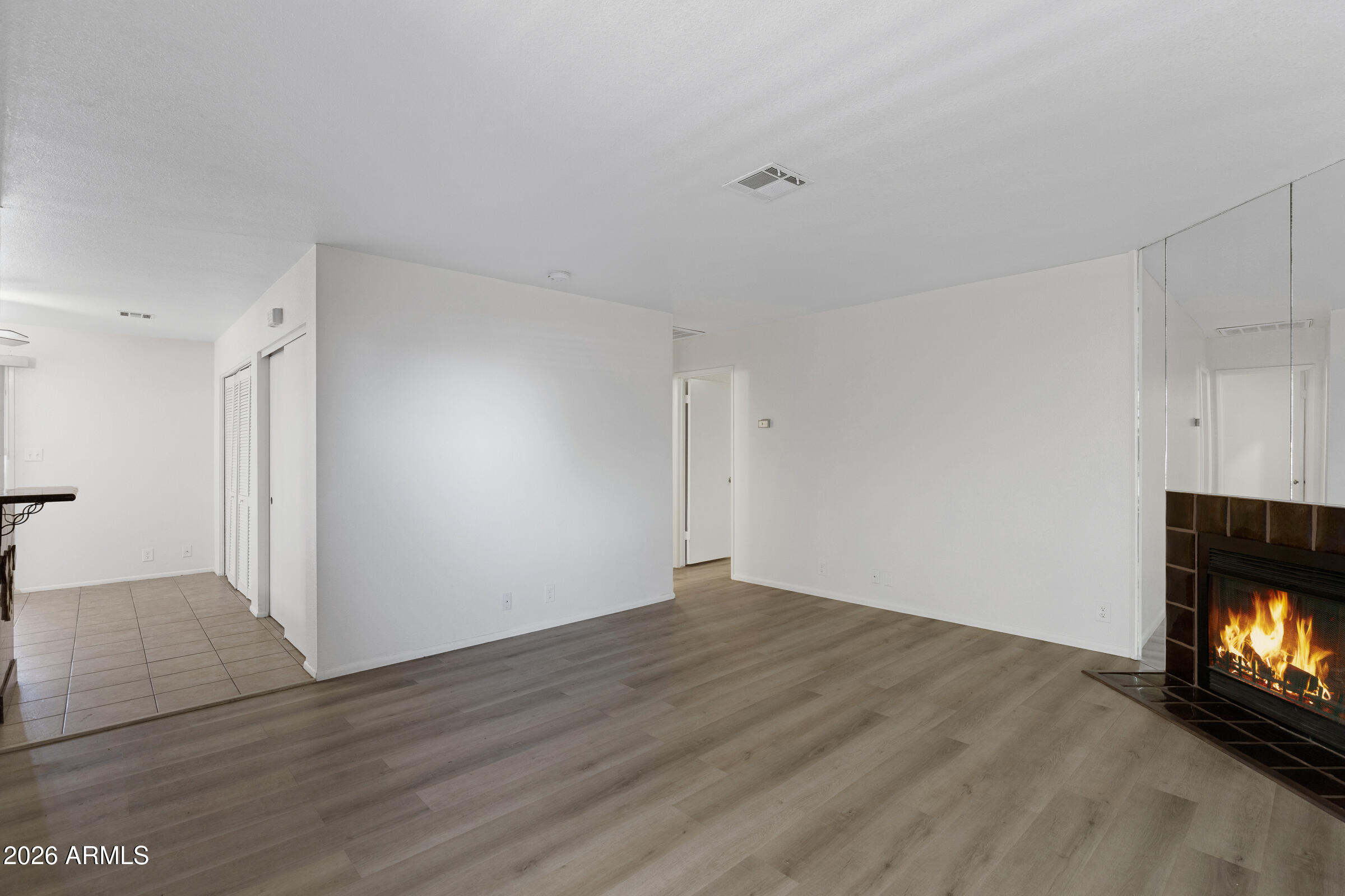 20235 North 3rd Drive, Unit 8 Phoenix, AZ 85027 - Photo 4 of 30 a view of an empty room and fire place