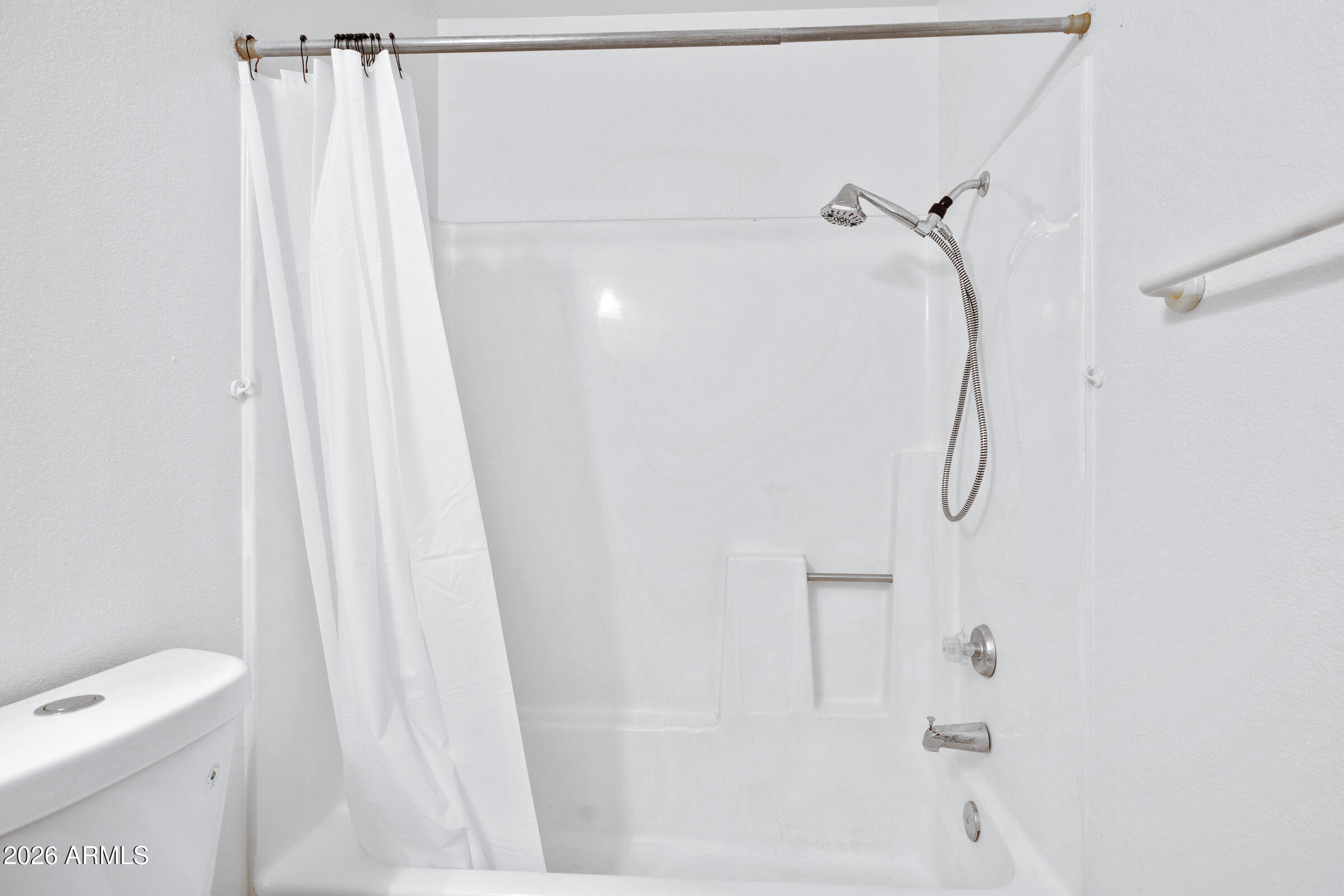 20235 North 3rd Drive, Unit 8 Phoenix, AZ 85027 - Photo 7 of 30 a bathroom with a shower curtain and a shower curtain