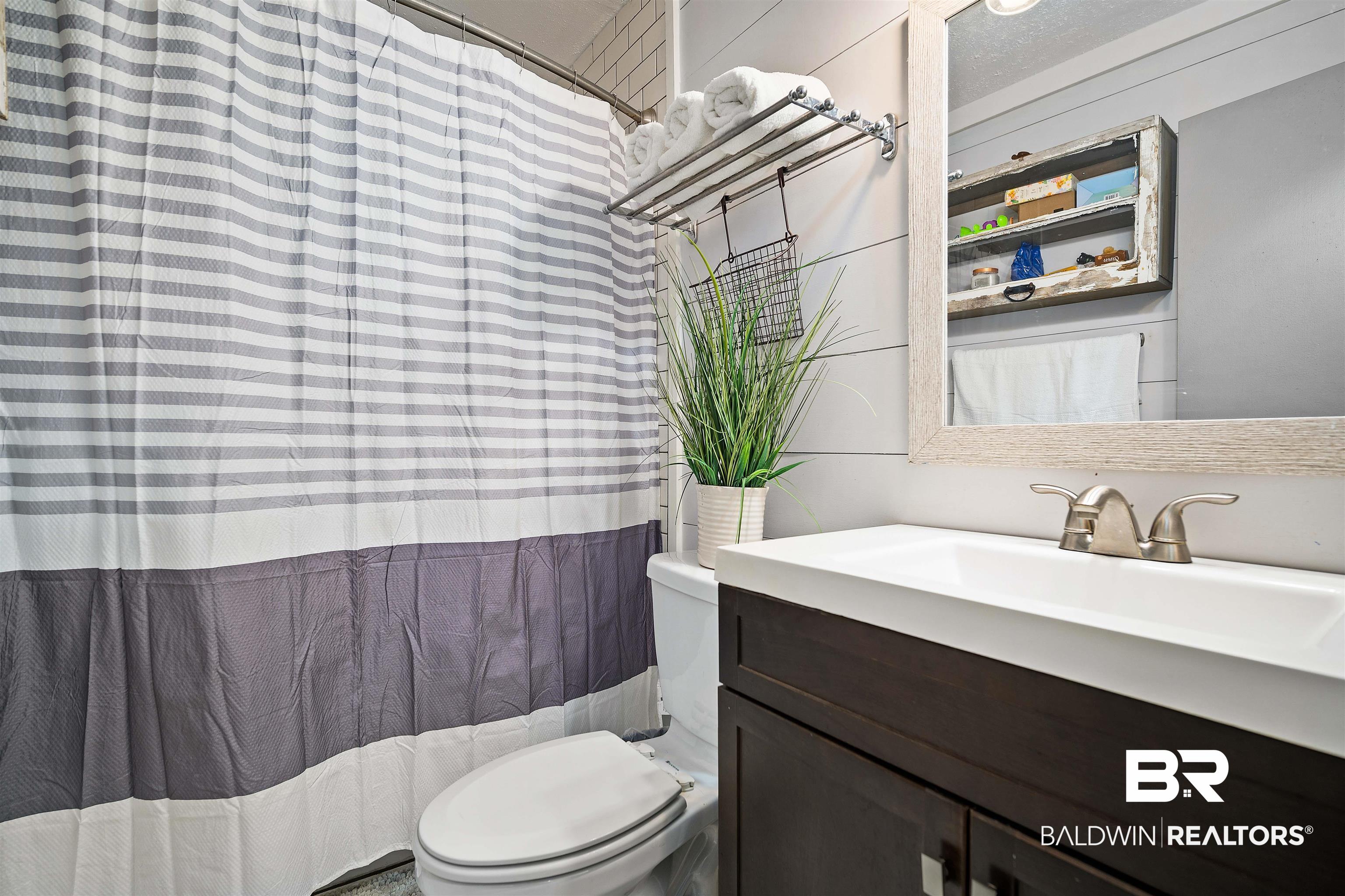 5110 Wilmer Road Wilmer, AL 36587 - Photo 17 of 24 Bathroom with vanity and toilet