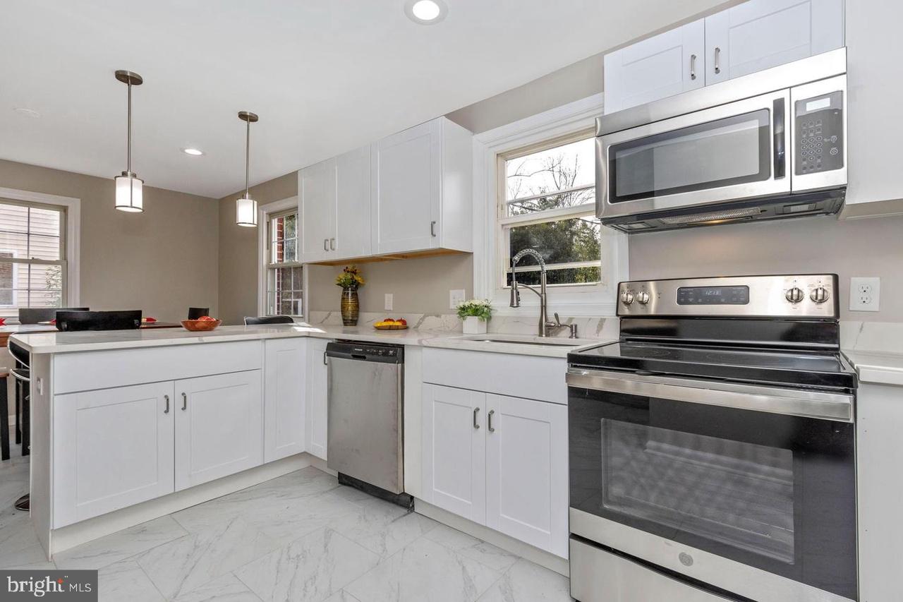 6738 Allview Drive Columbia, MD 21046 - Photo 11 of 33 a kitchen with appliances a sink and cabinets
