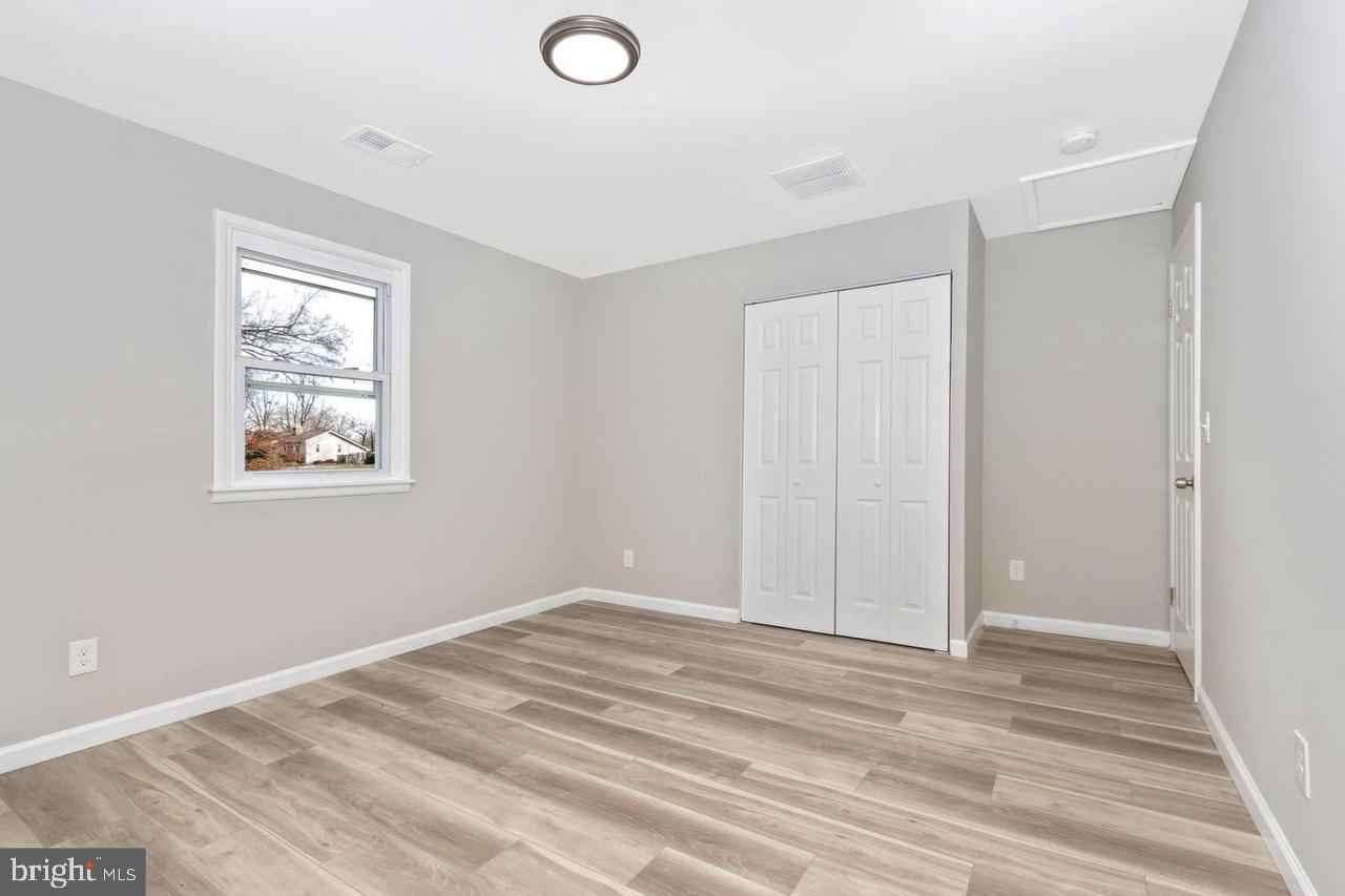 6738 Allview Drive Columbia, MD 21046 - Photo 14 of 33 a view of room with window and ceiling fan