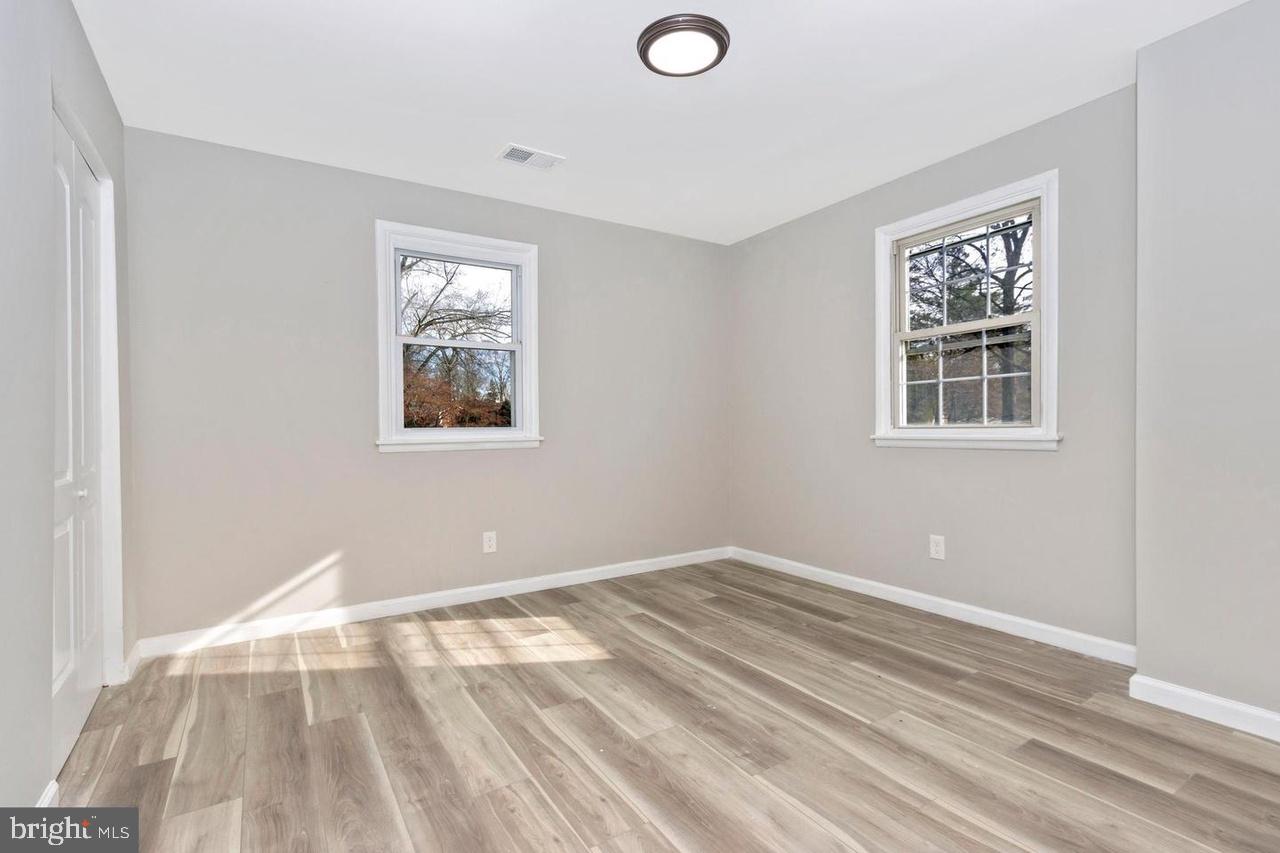 6738 Allview Drive Columbia, MD 21046 - Photo 17 of 33 a view of a big room with wooden floor and windows
