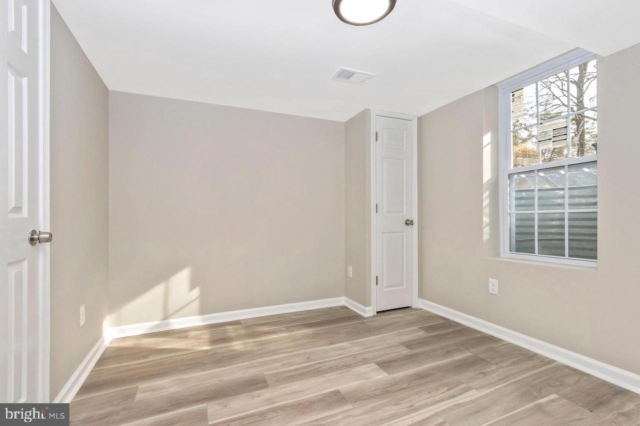 6738 Allview Drive Columbia, MD 21046 - Photo 26 of 33 a view of a livingroom with wooden floor and a window