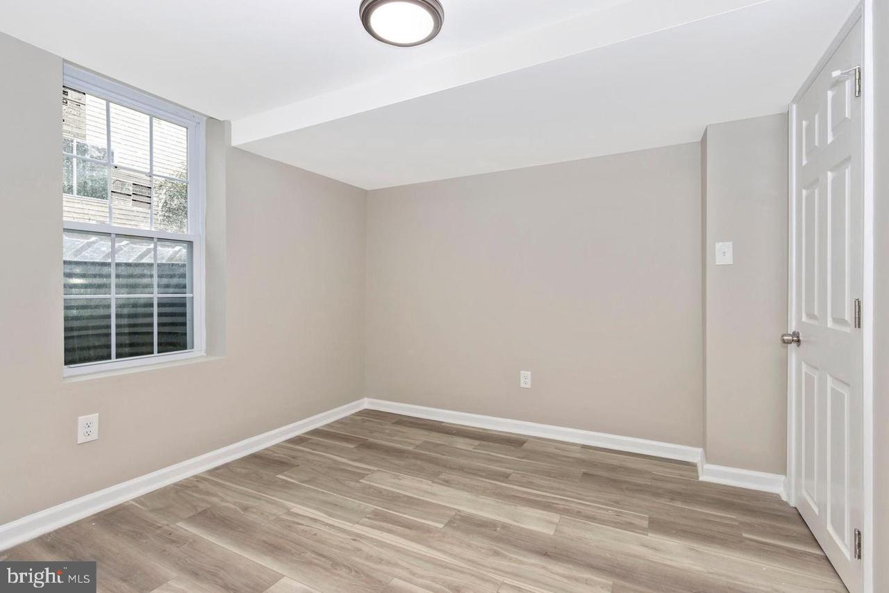 6738 Allview Drive Columbia, MD 21046 - Photo 27 of 33 a view of empty room with wooden floor