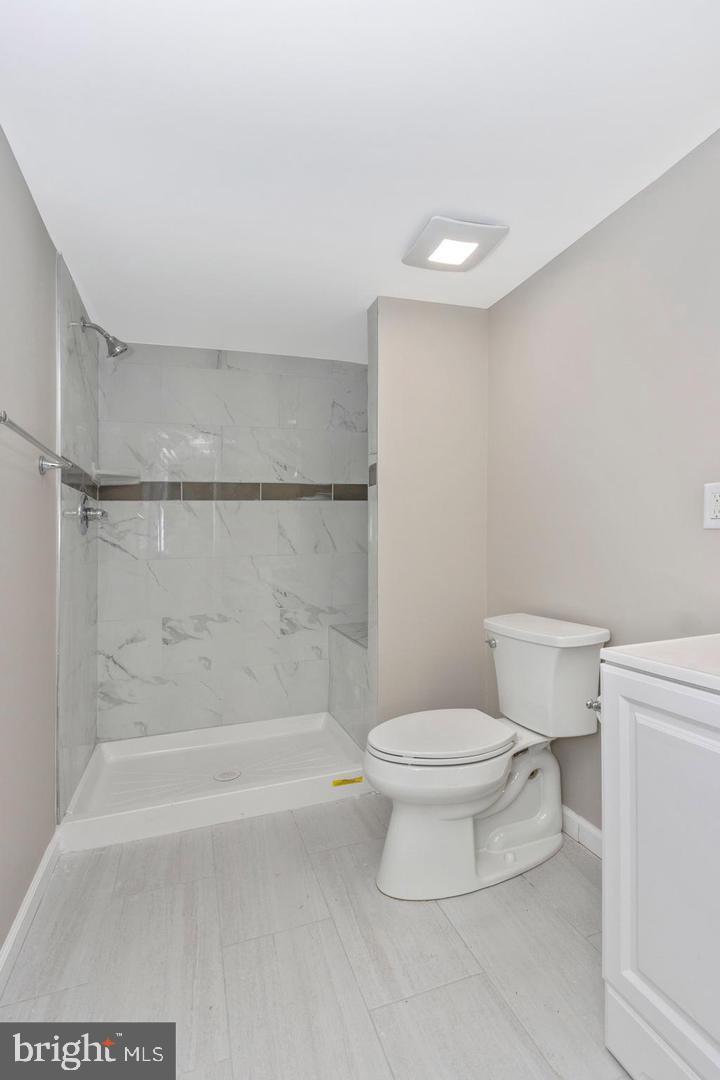 6738 Allview Drive Columbia, MD 21046 - Photo 29 of 33 a bathroom with a toilet and a shower
