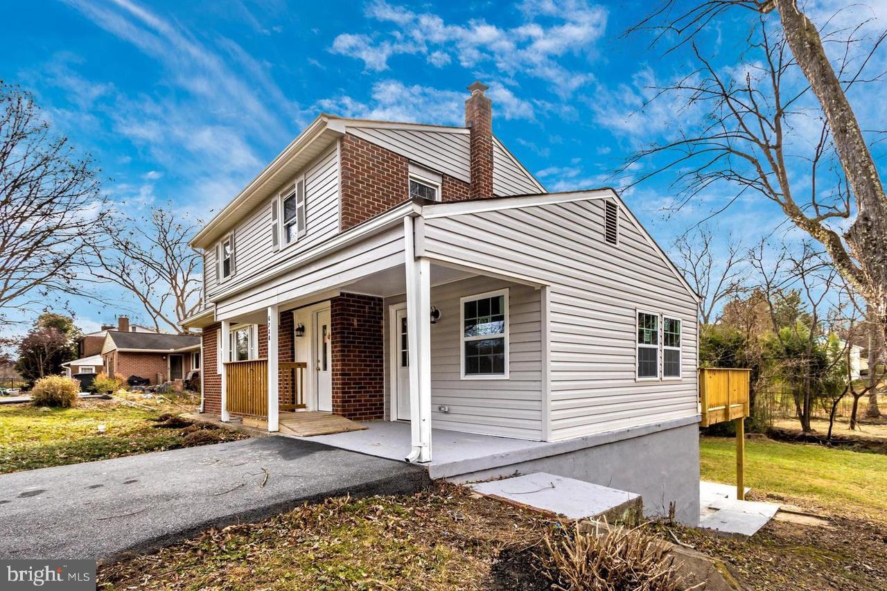 6738 Allview Drive Columbia, MD 21046 - Photo 30 of 33 a view of a white house with a large tree