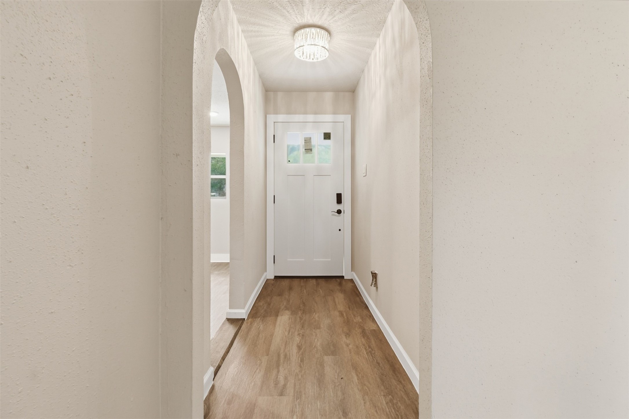 4767 Beechaven Street Houston, TX 77053 - Photo 17 of 26 a view of a hallway with wooden floor